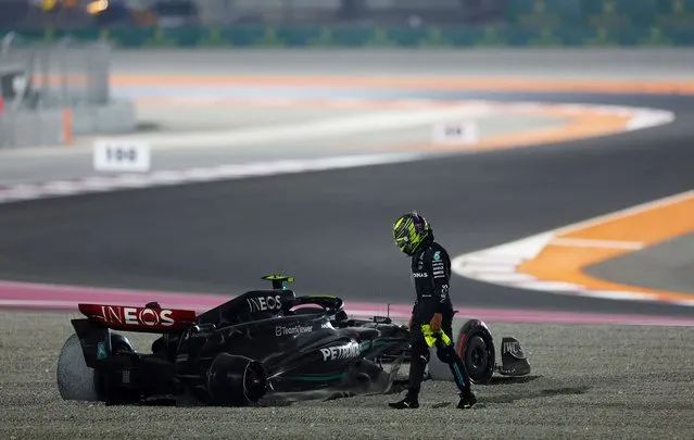 Lewis Hamilton of Mercedes AMG Petronas F1 Team stands by his car after a first-corner collision with George Russell of Mercedes-AMG F1 during the F1 Qatar Grand Prix at Losail Circuit in Doha, Qatar on October 08, 2023. (Photo by Rula Rouhana/Reuters)