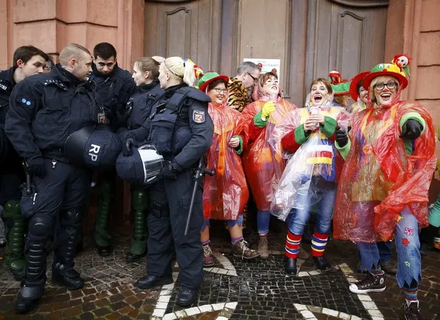 Police patrol as revellers take part in the traditional “Weiberfastnacht” (Women's Carnival) celebration in Mainz, Germany, February 4, 2016. (Photo by Kai Pfaffenbach/Reuters)