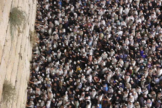 Tens of thousands of Israelis gather for the Selichot prayers (forgiveness) before Yom Kippur, the Day of Atonement and the holiest of Jewish holidays, at the Western Wall in the Old City of Jerusalem, 23 September 2023. Yom Kippur is a 25-hour period of fasting, intense reflection and prayers where the central theme is the Day of Atonement that begins on 24 September before sunset. (Photo by Abir Sultan/EPA)