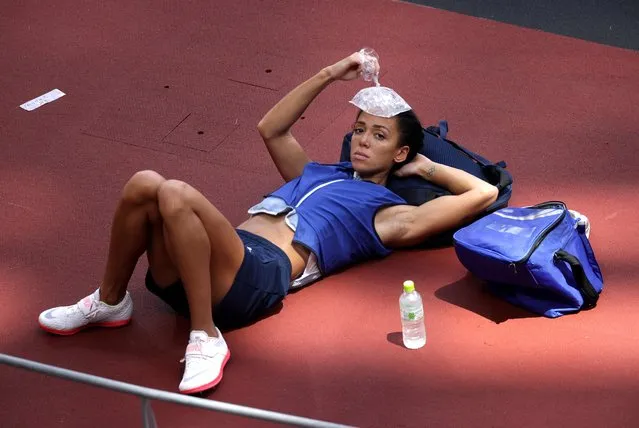 Great Britain's Katarina Johnson-Thompson places an ice pack on her head before of the Women's Heptathlon High Jump at the Olympic Stadium on the twelfth day of the Tokyo 2020 Olympic Games in Japan on Wednesday, August 4, 2021. (Photo by Hannah Mckay/Reuters)
