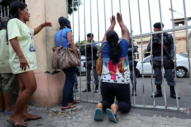 Relatives of inmates react in front of Desembargador Raimundo Vidal Pessoa jail in the center of the Amazonian city of Manaus, Brazil, January 8, 2017. (Photo by Michael Dantas/Reuters)