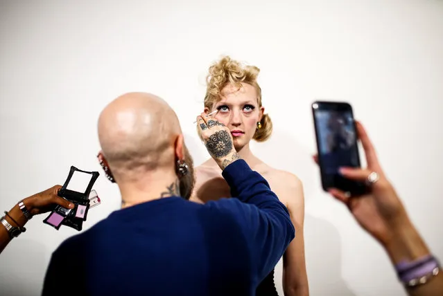 A model is prepared backstage before the Mark Fast show at London Fashion Week Women's A/W19 in London, Britain February 15, 2019. (Photo by Henry Nicholls/Reuters)