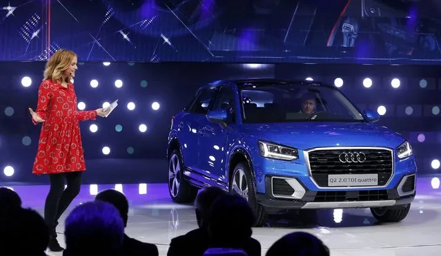 Host Mirjam Weichselbraun presents the new Audi Q2 car at the 86th International Motor Show in Geneva, Switzerland, March 1, 2016. (Photo by Denis Balibouse/Reuters)