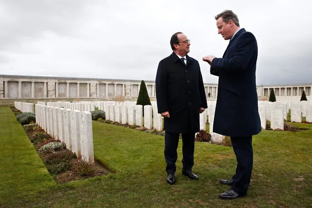 French President Francois Hollande (L) and British Prime Minister David Cameron (R) speak as they pay their respects at the Pozieres British Memorial as part of the 34th Franco-British summit, in Pozieres, near Amiens, France, 03 March 2016. The centenary of the Battle of the Somme will be commemorated in 2016. The migrant crisis in Calais will be discussed at the 34th Franco-British summit. (Photo by Yoan Valat/EPA)