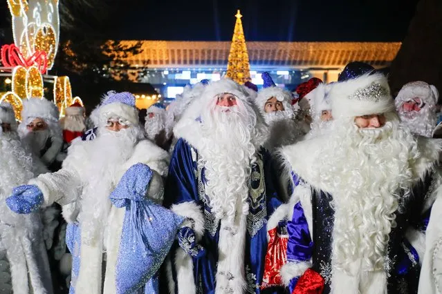 Participants dressed as Ayaz Ata (Father Frost) - the Kazakh equivalent of Santa Claus take part in a procession through city streets while marking the New Year and Christmas season in Almaty, Kazakhstan on December 25, 2023. (Photo by Pavel Mikheyev/Reuters)