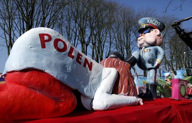 A carnival float with papier-mache caricatures featuring the leader of Polish Law and Justice party Jaroslaw Kaczynski oppressing Poland,is displayed at a postponed “Rosenmontag” (Rose Monday) parade, at one location in Duesseldorf, Germany, March 13, 2016, after the original parade in February was cancelled due to severe weather. (Photo by Ina Fassbender/Reuters)