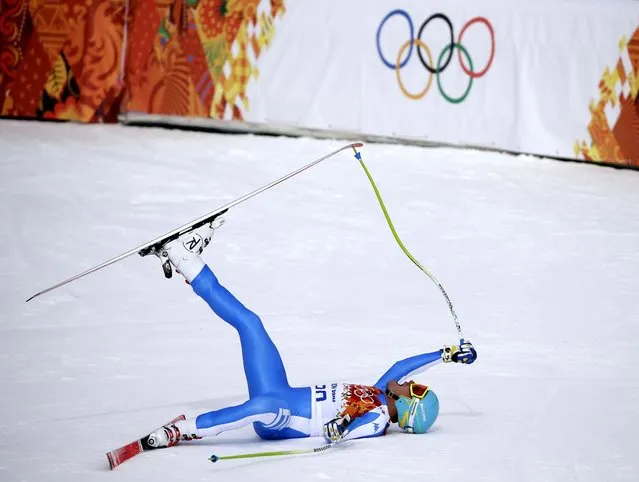 Italy's Christof Innerhofer celebrates after finishing the men's downhill of the Sochi 2014 Winter Olympics, in Krasnaya Polyana, Russia, on February 9, 2014. (Photo by Gero Breloer/Associated Press)