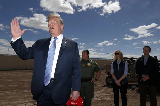 President Donald Trump visits a new section of the border wall with Mexico in Calexico, Calif., Friday April 5, 2019. (Photo by Jacquelyn Martin/AP Photo)