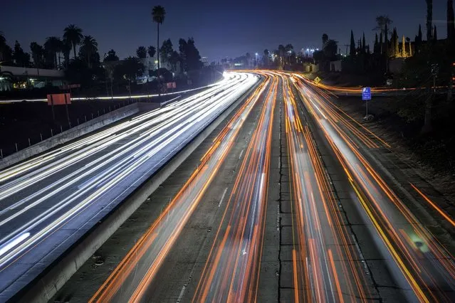 Cars and trucks are slowly moving during the evening's rush hour on Hollywood Freeway (Highwayy 101) in Los Angeles California on February 13, 2014. (Photo by Joe Klamar/AFP Photo)