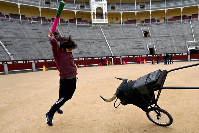 A pupil practices at the Bullfighting School in Las Ventas bullring in Madrid on February 4, 2021. (Photo by Gabriel Bouys/AFP Photo)