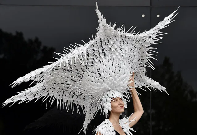 Horse Racing - Royal Ascot - Ascot Racecourse - 17/6/15
Racegoer Larisa Katz poses with her own hat design made from recycled plastic spoons as she attends the second day of racing
Reuters / Toby Melville
Livepic
