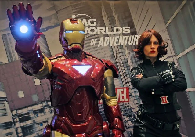 Marvel heroes, Iron Man and Black Widow pose at the IMG Worlds of Adventure press conference in Dubai, United Arab Emirates, Sunday, April 24, 2016. Dubai will soon have a one-stop destination for families whose tastes run from Spider-Man to velociraptors to the Powerpuff Girls. Local developer Ilyas and Mustafa Galadari Group said Sunday that a new 1.5 million square-foot (139,355 square meter) indoor amusement park it is building on the city's desert outskirts will open on August 15. (Photo by Kamran Jebreili/AP Photo)