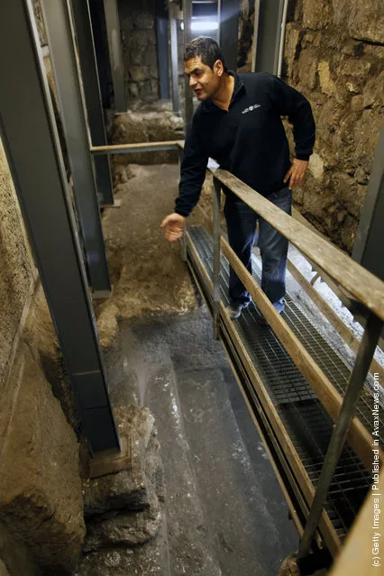 Israeli Archaeologist Eli Shukron of the Israel Antiquities Authority speaks inside a ritual bath exposed beneath the Western Wall in Jerusalem's Old City, Israel