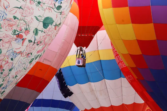 Hot air balloons are seen during a hot air balloon competition in Hefei, Anhui province, China April 27, 2016. (Photo by Reuters/Stringer)