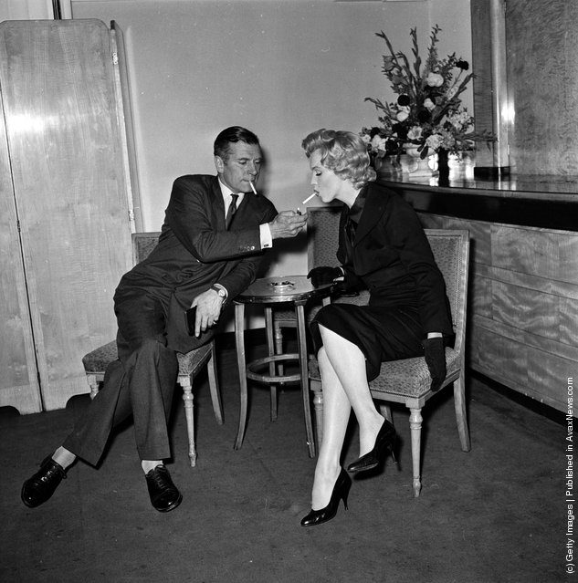 American actress Marilyn Monroe (1926 - 1962) and English actor and director Laurence Olivier (1907 - 1989) at a press conference at the Savoy Hotel, London, July 1956