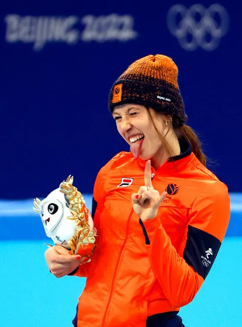 Suzanne Schulting of the Netherlands celebrates on the podium after winning the gold medal in the Women's 1,000m final A of the Short Track Speed Skating events at the Beijing 2022 Olympic Games in Beijing, China, 11 February 2022. (Photo by How Hwee Young/EPA/EFE)