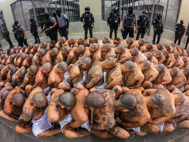 The arrival of inmates belonging to the MS-13 and 18 gangs to the new prison “Terrorist Confinement Centre” (CECOT), in Tecoluca, 74 km southeast of San Salvador, on February 25, 2023. The first group of 2,000 suspected gang members in El Salvador has been moved to a huge new prison, the centerpiece of President Nayib Bukele's self-declared war on crime. Tens of thousands of suspected gangsters have been rounded up in the country under a state of emergency following a spike in murders and other violent crimes. (Photo by Press Secretary Of The Presidency Of El Salvador/Handout/Anadolu Agency via Getty Images)