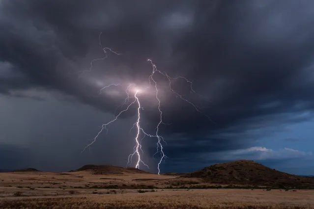 Lightning strikes south of Camp Verde just after sunset in July 2013. (Photo by Mike Olbinski/Barcroft Media)