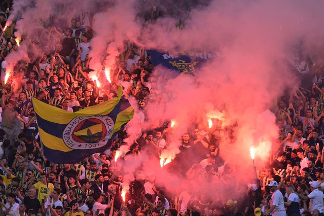 Fenerbahce's supporters light smoke flares during the presentation of their new coach Jose Mourinho at the Sukru Saracoglu Stadium in Istanbul on June 2, 2024. Two-time Champions League winning Jose Mourinho will be the new coach of Turkish club Fenerbahce, he announced on June 1. The Portuguese coach, who won the Champions League with Porto and Inter Milan, has not worked since he was sacked by Italian Serie A side Roma in January 2024. (Photo by Yasin Akgul/AFP Photo)