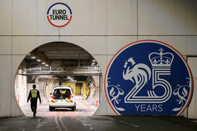 Workers drive in the Channel Tunnel (Tunnel sous la Manche) during a “sleepless night” reserved for maintenance, on February 12, 2023. The Channel Tunnel opened in 1994 and is composed of two single-track tunnels and a service tunnel each 50 kilometres (31 miles) long. The undersea section covers 38km and is the longest in the world. (Photo by Francois Lo Presti/AFP Photo)