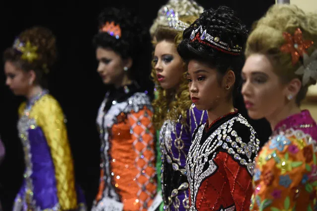 Dancers wait backstage before performing during the World Irish Dancing Championships in Dublin, Ireland on April 11, 2017. (Photo by Clodagh Kilcoyne/Reuters)