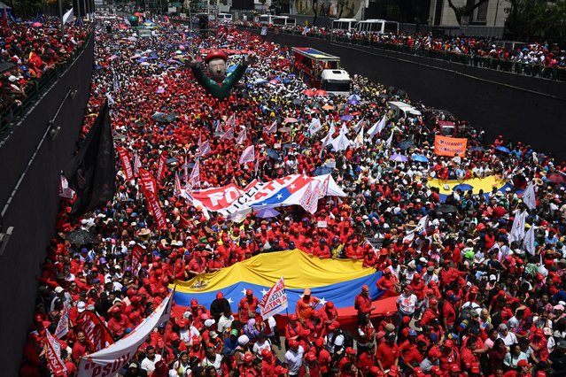 Supporters of Venezuelan President Nicolas Maduro's government participate in a march during a May Day (Labour Day) rally to mark the international day of the workers in Caracas on May 1, 2024. (Photo by Federico Parra/AFP Photo)