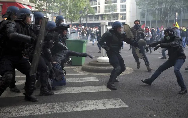 Riot police clash with protestors during a demonstration against French labour law reform in Paris, France, May 12, 2016. (Photo by Gonzalo Fuentes/Reuters)