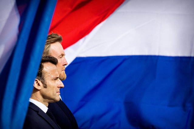 King Willem-Alexander of The Netherlands welcomes French President Emmanuel Macron with an official welcome ceremony at the Royal Palace on April 11, 2023 in Amsterdam, Netherlands. The French president is in The Netherlands for a two day state visit. (Photo by Patrick van Katwijk/Getty Images)