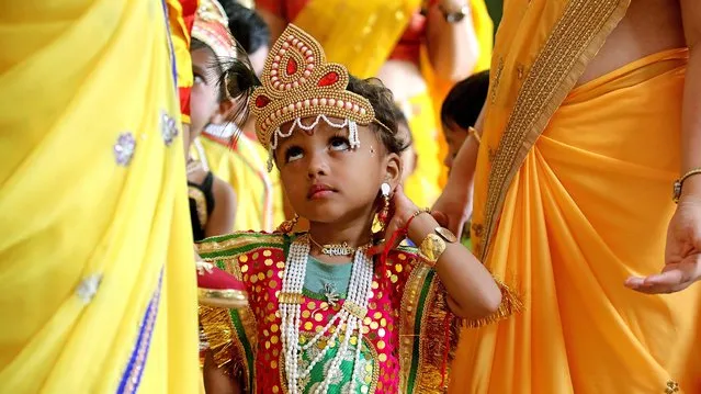 Public school children dressed as Lord Krishna and Goddess Radha celebrate the Janmashtmi festival, the birth anniversary of Lord Krishna, in Bhopal, India, 22 August 2019. Lord Krishna is a major Hindu deity and is the god of compassion, tenderness and love. (Photo by Sanjeev Gupta/EPA/EFE)
