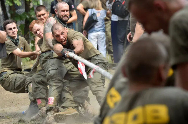 Recruits to the Azov far-right Ukrainian volunteer battalion, take part in their competition in Kiev, on August 14, 2015 prior leaving to the battle fields of eastern Ukraine. (Photo by Sergei Supinsky/AFP Photo)