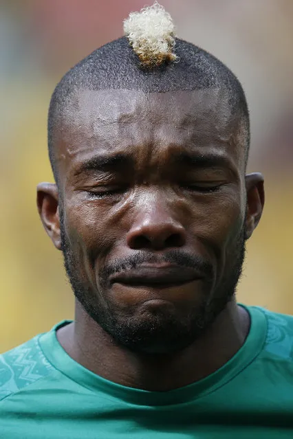 Ivory Coast's Geoffroy Serey Die cries during the playing of his national anthem before the 2014 World Cup Group C soccer match against Colombia at the Brasilia national stadium in Brasilia, June 19, 2014. (Photo by Ueslei Marcelino/Reuters)