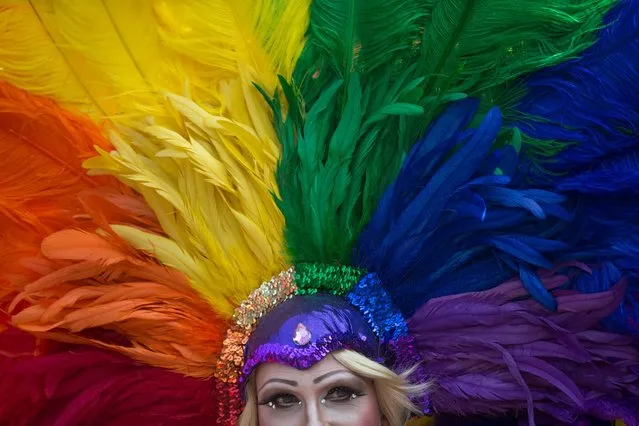 A person who identifies themselves as “Miss Lola”, of Long Beach, Calif., attends the Vancouver Pride Parade in Vancouver, British Columbia, Sunday, August 2, 2015. Organizers expected hundreds of thousands of people to take part in the parade. (Photo by Darryl Dyck/The Canadian Press via AP Photo)