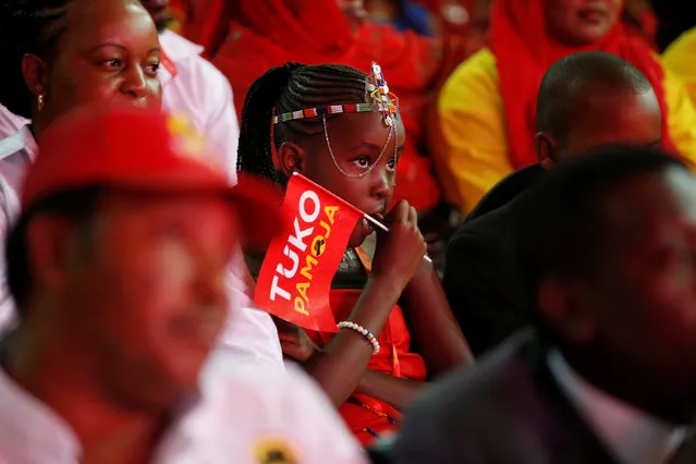 A young girl attends an event unveiling the Jubilee Party's manifesto in Nairobi, Kenya June 26, 2017. (Photo by Baz Ratner/Reuters)