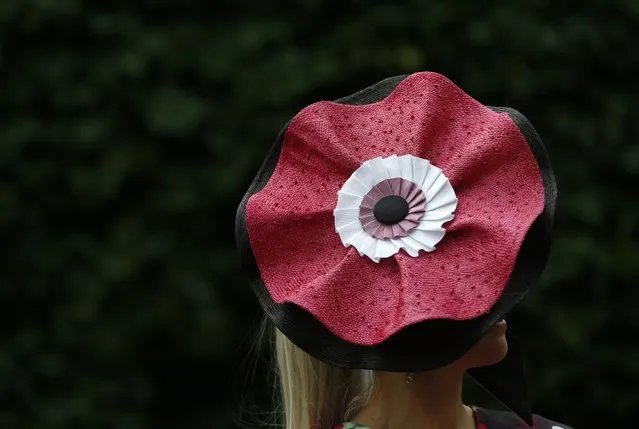 A woman wears an ornate hat on the first day of the Royal Ascot horse race meeting at Ascot, England, Tuesday, June, 14, 2016. (Photo by Alastair Grant/AP Photo)