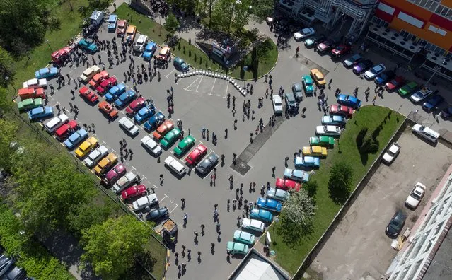 Participants attend a gathering of Soviet-era Moskvich cars owners and enthusiasts in Moscow, Russia on May 21, 2022. (Photo by Lev Sergeev/Reuters)
