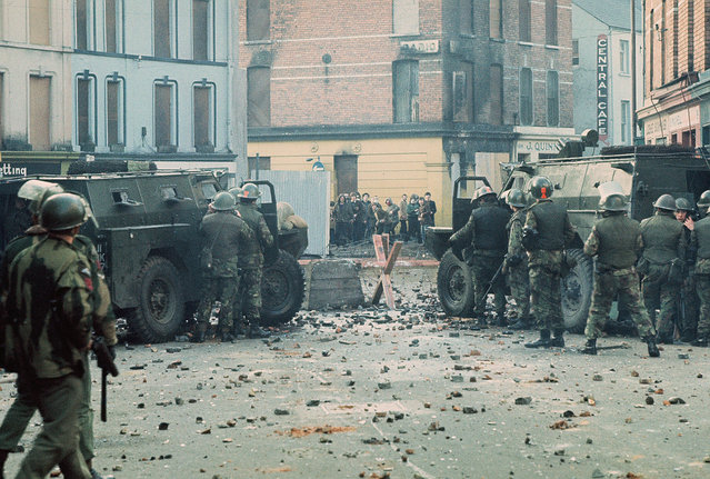 Youths confront British soldiers minutes before paratroopers opened fire killing 14 civilians on what became known as Bloody Sunday. The standoff is near barricade 14 on William Street, Derry/Londonderry, Northern Ireland on 30th January 1972. (Photo by William L. Rukeyser/Getty Images)