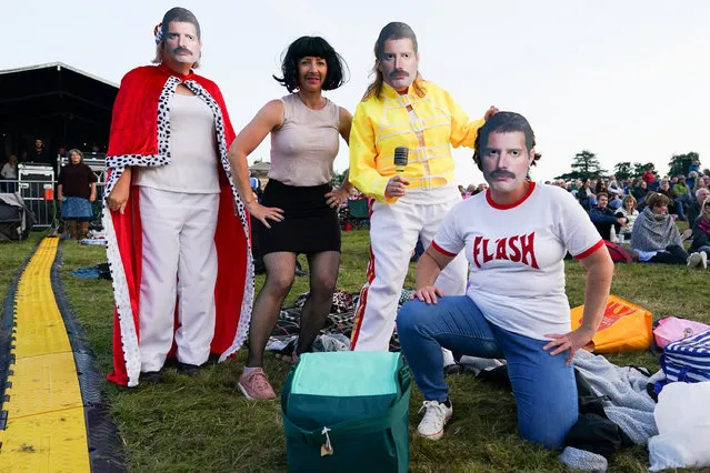A group of friends dress as singer Freddie Mercury from the rock group Queen during the Queen Symphonic tour at Castle Howard on August 22, 2021 in York, England. Forming part of the Castle Howard Live Music Weekend 2021, the rock and symphonic tour celebrates the greatest hits of rock group Queen and includes full symphonic arrangements, vocals, a five piece rock band and The Heart of England Philharmonic Orchestra all honouring the band's hits. The tour has seen over 30 UK summer shows, playing to an audience over 150,000. (Photo by Ian Forsyth/Getty Images)