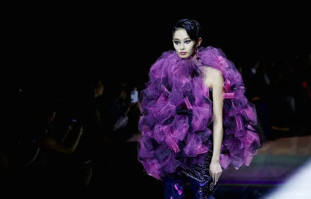 A model presents a creation by designer Giorgio Armani as part of his Haute Couture Fall/Winter 2022-2023 collection show for fashion house Giorgio Armani Prive in Paris, France on July 5, 2022. (Photo by Johanna Geron/Reuters)