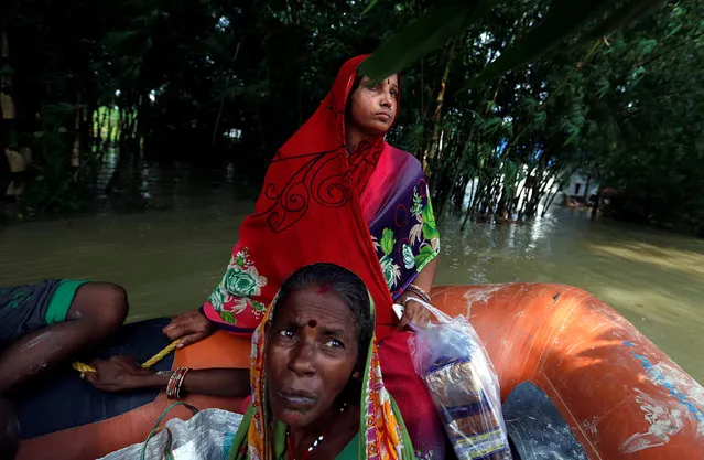 People are rescued from a flooded village in the eastern state of Bihar, India August 22, 2017. (Photo by Cathal McNaughton/Reuters)