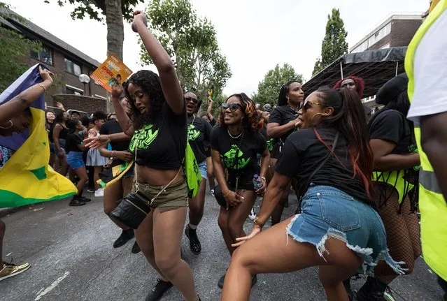 Participants dance during Children's Parade of the Notting Hill Carnival in London on August 28, 2022. Two million revellers are expected to take part in Notting Hill Carnival, Europe's largest street party and a celebration of African-Caribbean traditions, as it returns to the streets of west London after a two-year hiatus caused by the Covid-19 pandemic. (Photo by Wiktor Szymanowicz/EPA/EFE/Rex Features/Shutterstock)