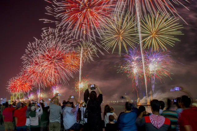 Fireworks illuminate the sky over the capital Abu Dhabi on December 1, 2017, during celebrations ahead of the 46th Emirati National Day, celebrated on December 2. (Photo by Nezar Balout/AFP Photo)