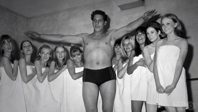 French wrestler Andre Rene Roussimoff, best known as “Andre the Giant” during a fashion exhibition. At 19, Andre stands 7 feet and 4 inches tall. (Photo by Universal/Corbis/VCG via Getty Images)