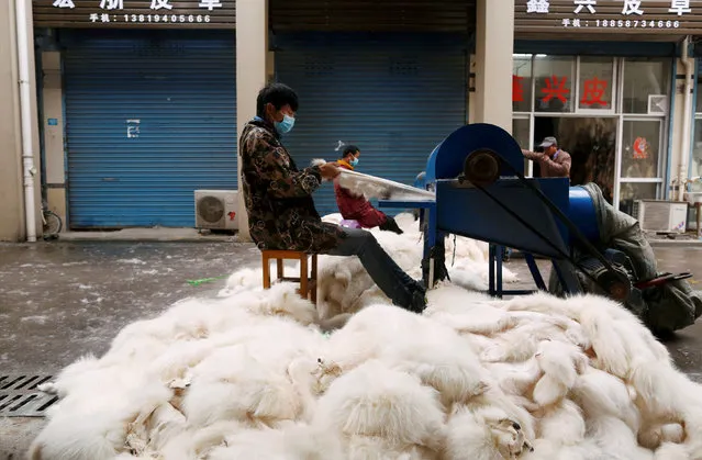 Workers process fox fur with machinery at a fur market in Chongfu, Zhejiang province, China December 14, 2017. Picture taken December 14, 2017. (Photo by William Hong/Reuters)