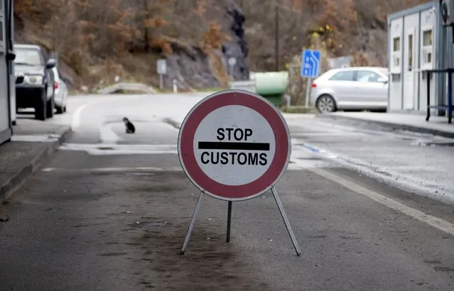 A traffic sign is seen at the closed border crossing of Jarinje, along the Kosovo-Serbia border, Kosovo, Sunday, December 11, 2022. Kosovo police and the local media on Sunday reported explosions, shooting and road blocks overnight in the north of the country, where the popoulation is mostly ethnic Serb, despite the postponement of the Dec. 18 municipal election the Serbs were opposed to. No injuries have been reported. (Photo by Marjan Vucetic/AP Photo)
