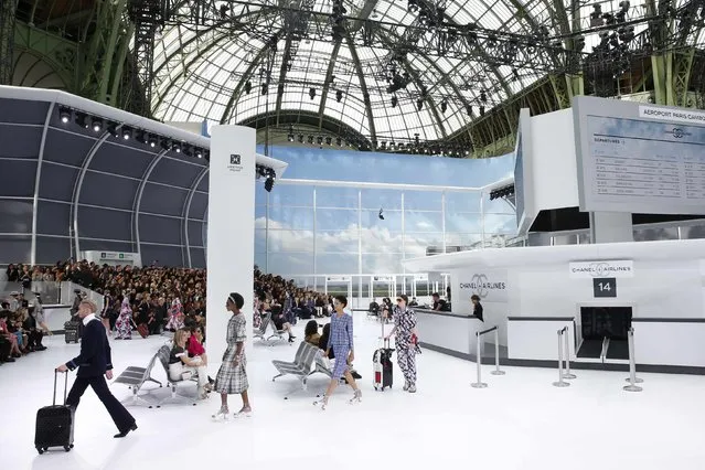 Models present creations by German designer Karl Lagerfeld as part of his Spring/Summer 2016 women's ready-to-wear collection for fashion house Chanel at the Grand Palais which is transformed into a Chanel airport during Fashion Week in Paris, France, October 6, 2015. (Photo by Benoit Tessier/Reuters)