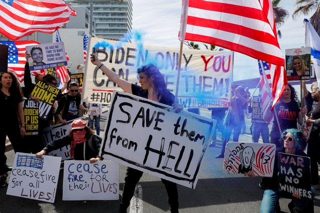 Demonstrators take part in a rally calling for the release of hostages kidnapped in the deadly October 7 attack on Israel by the Palestinian Islamist group Hamas from Gaza and for support from the United States, outside the Embassy of United States, in Tel Aviv, Israel on March 1, 2024. (Photo by Carlos Garcia Rawlins/Reuters)