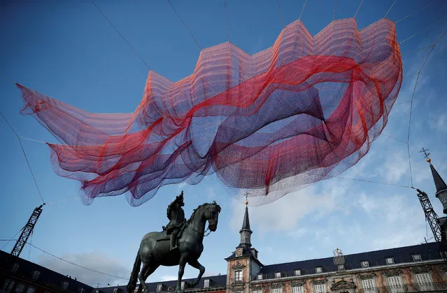 An installation by American sculptor Janet Echelman is dispayed as part of the 400-year anniversary celebrations of Plaza Mayor in Madrid, Spain on February 11, 2018. (Photo by Burak Akbulut/Anadolu Agency/Getty Images)