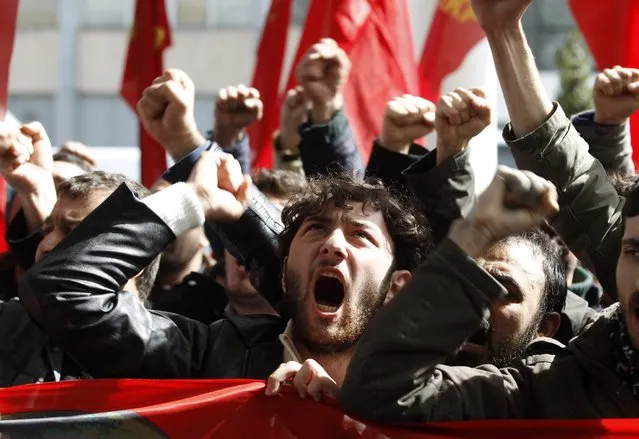 Turkish Communist Party supporters shout slogans during a protest against the Syrian National Coalition in front of a hotel where the Syrian opposition is holding a meeting in Istanbul March 19, 2013. The opposition Syrian National Coalition chose Western-educated former businessman Ghasssan Hitto as provisional prime minister in a vote on Tuesday at the meeting in Istanbul. (Photo by Osman Orsal/Reuters)