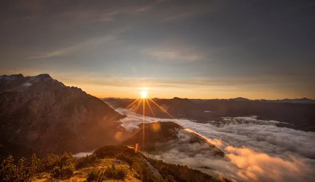 The sun rises over mountain summits in the Austrian village of Absam, Austria, September 13, 2017. (Photo by Dominic Ebenbichler/Reuters)