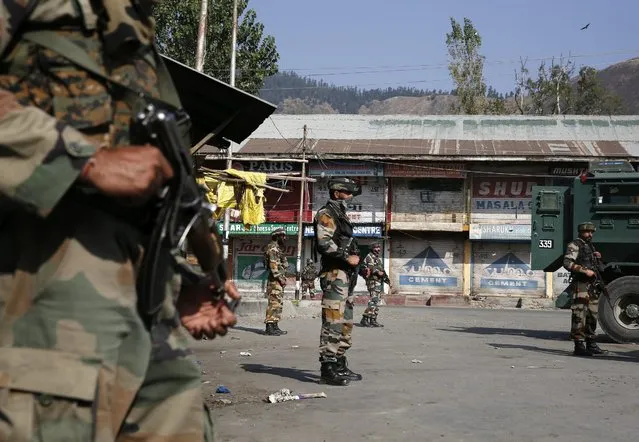 Indian army soldiers stand guard near army camp which was attacked by the militants in Baramulla some 50 kilometers north of Srinagar, the summer capital of Indian Kashmir, 03 October 2016. On 02 October (Sunday) night militants attacked an army camp in north Kashmir’s Baramulla district killing a Border Security Force (BSF) trooper and injuring another while militants escaped from the encounter site. Senior Superintendent  Police  Baramulla Imtiyaz Hussain said that army and BSF foiled the attempts of the militants to storm the 46 RR camp in Janbazpora in Baramulla. (Photo by Farooq Khan/EPA)